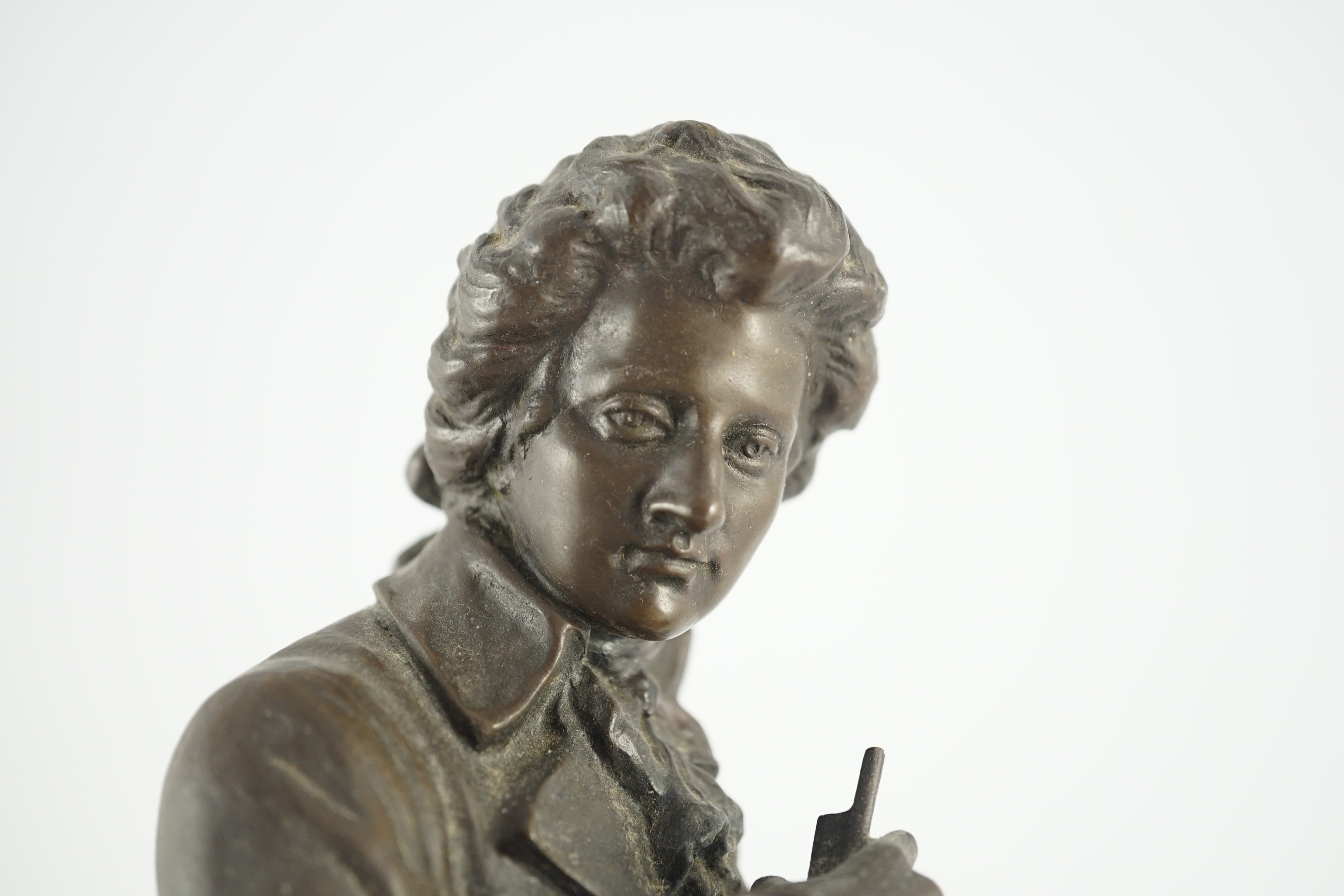 Carl Brose (German, 1880-). An early 20th century bronze figure of Mozart holding a violin, 41cm high